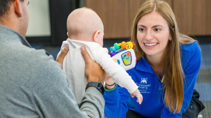 Woman playing with baby