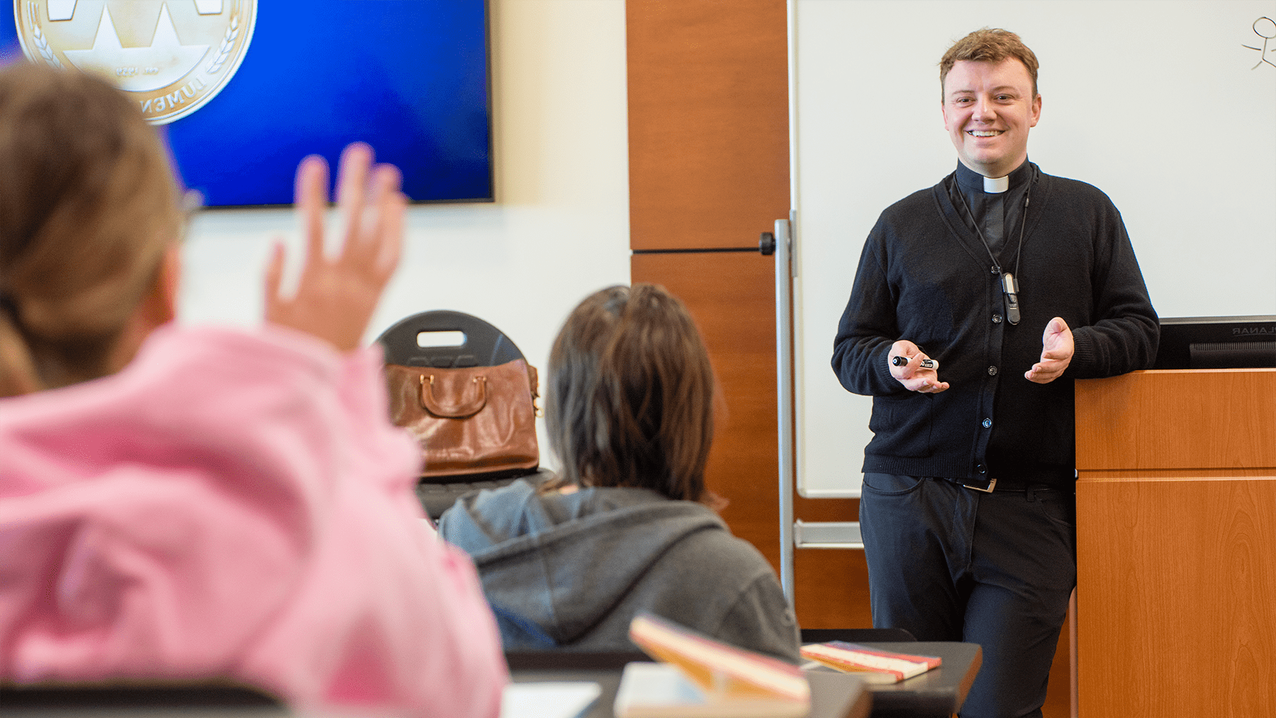 Fr Bouck teaching a Catholic Studies class.